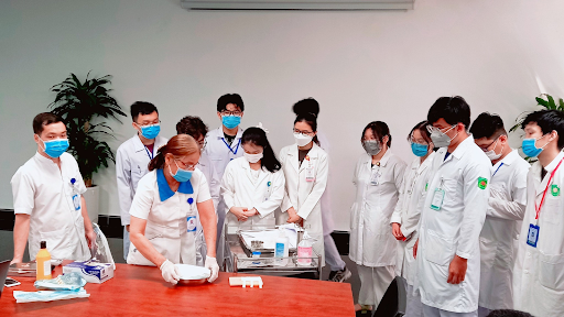 Students being guided through rigorous medical sterilization and disinfection protocols.
