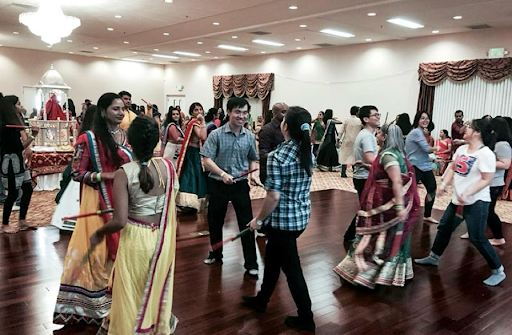 Students joining Indian-American physicians at an Indian cultural festival.