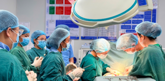 Students observing live surgical procedures performed by expert surgeons at Tan Tao University Hospital